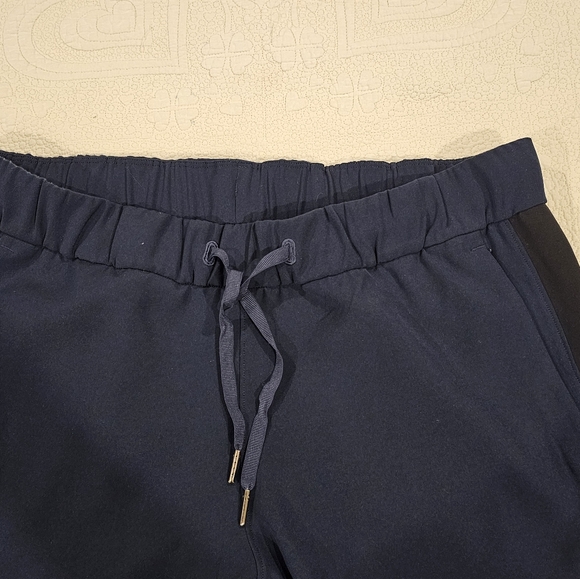 Sz 10 Lululemon tuxedo pant blue with black stripe on the sides. - Picture 10 of 13